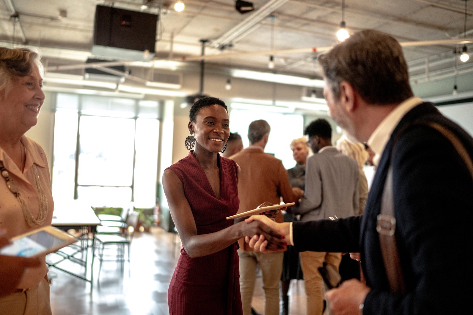 Business people shaking hands at business event